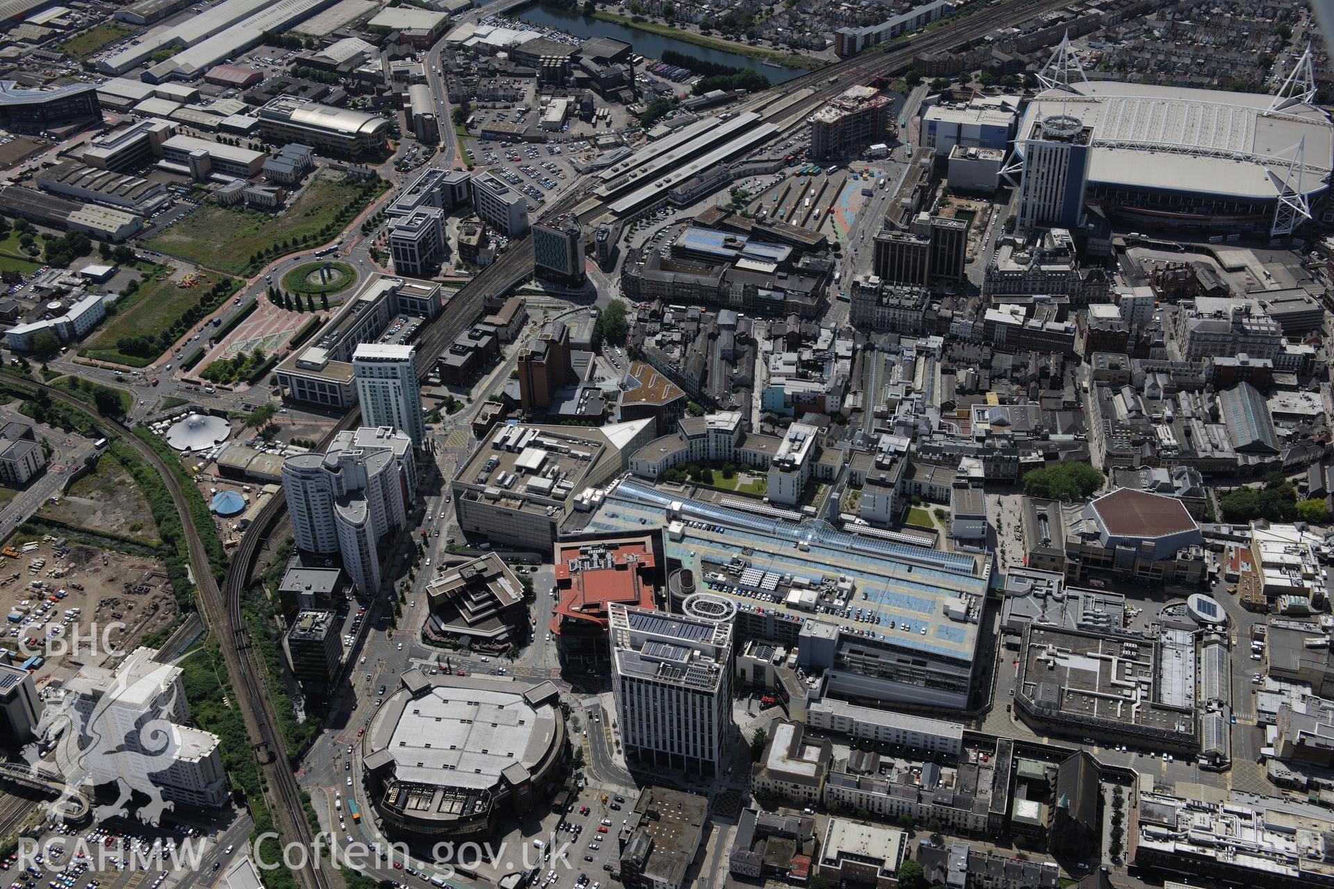 Millennium Stadium; St. David's shopping centre, Cardiff International Arena and Central Railway Station, Cardiff. Oblique aerial photograph taken during the Royal Commission's programme of archaeological aerial reconnaissance by Toby Driver on 29/06/2015.