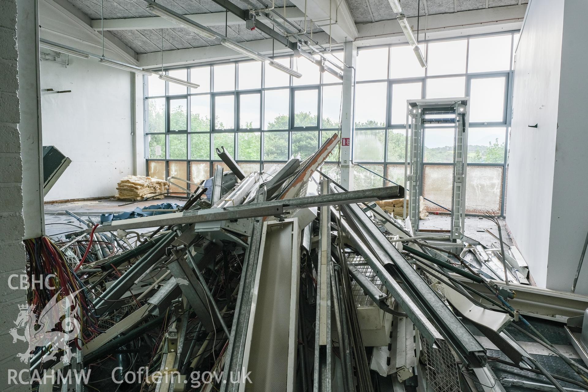 Digital colour photograph showing detailed interior view of room with scrap at Caernarfonshire Technical College, Ffriddoedd Road, Bangor. Photographed by Dilys Morgan and donated by Wyn Thomas of Grwp Llandrillo-Menai Further Education College, 2019.