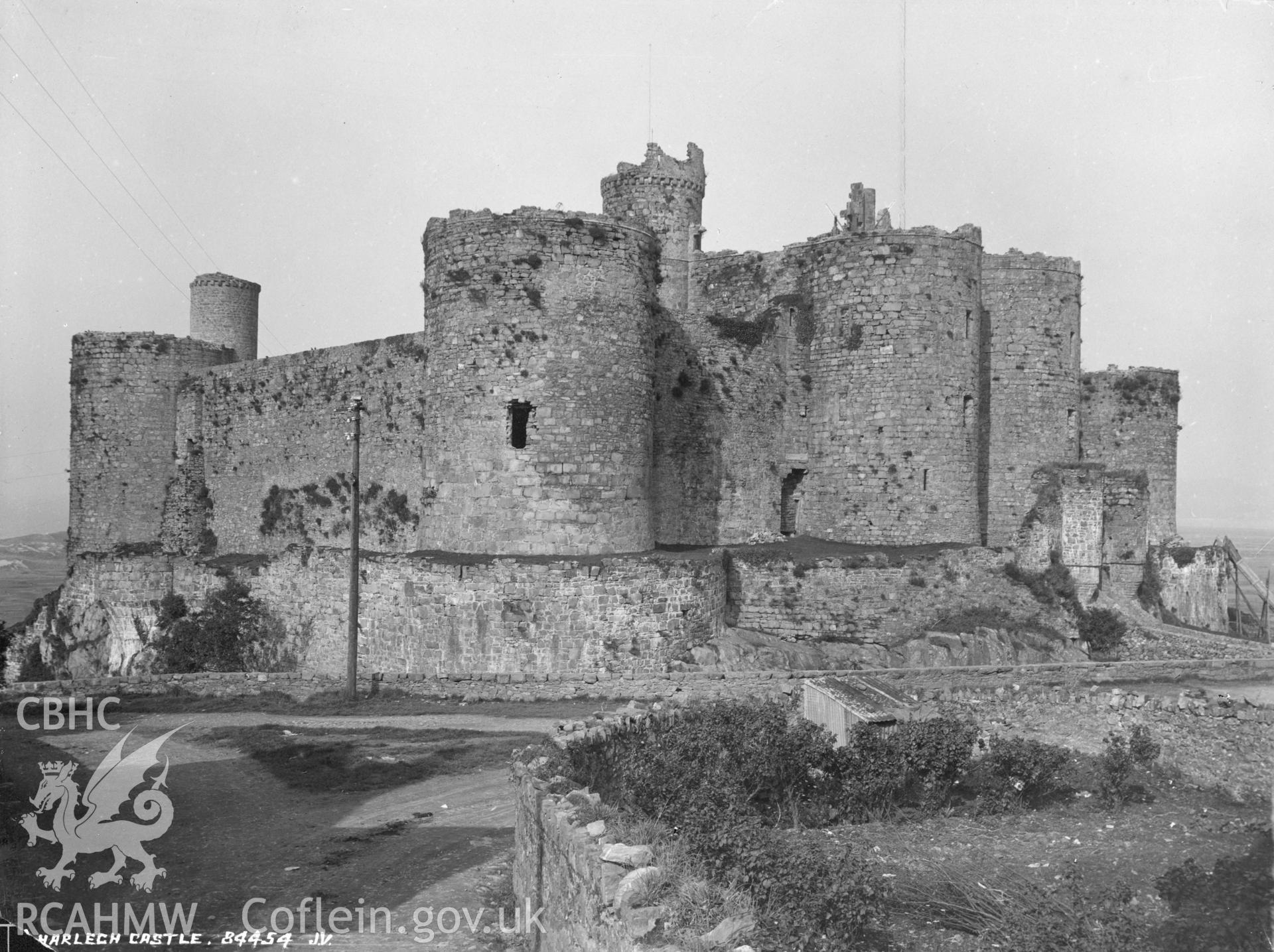 Digital copy of a black and white photographs relating to Harlech Castle: general view from south-east.