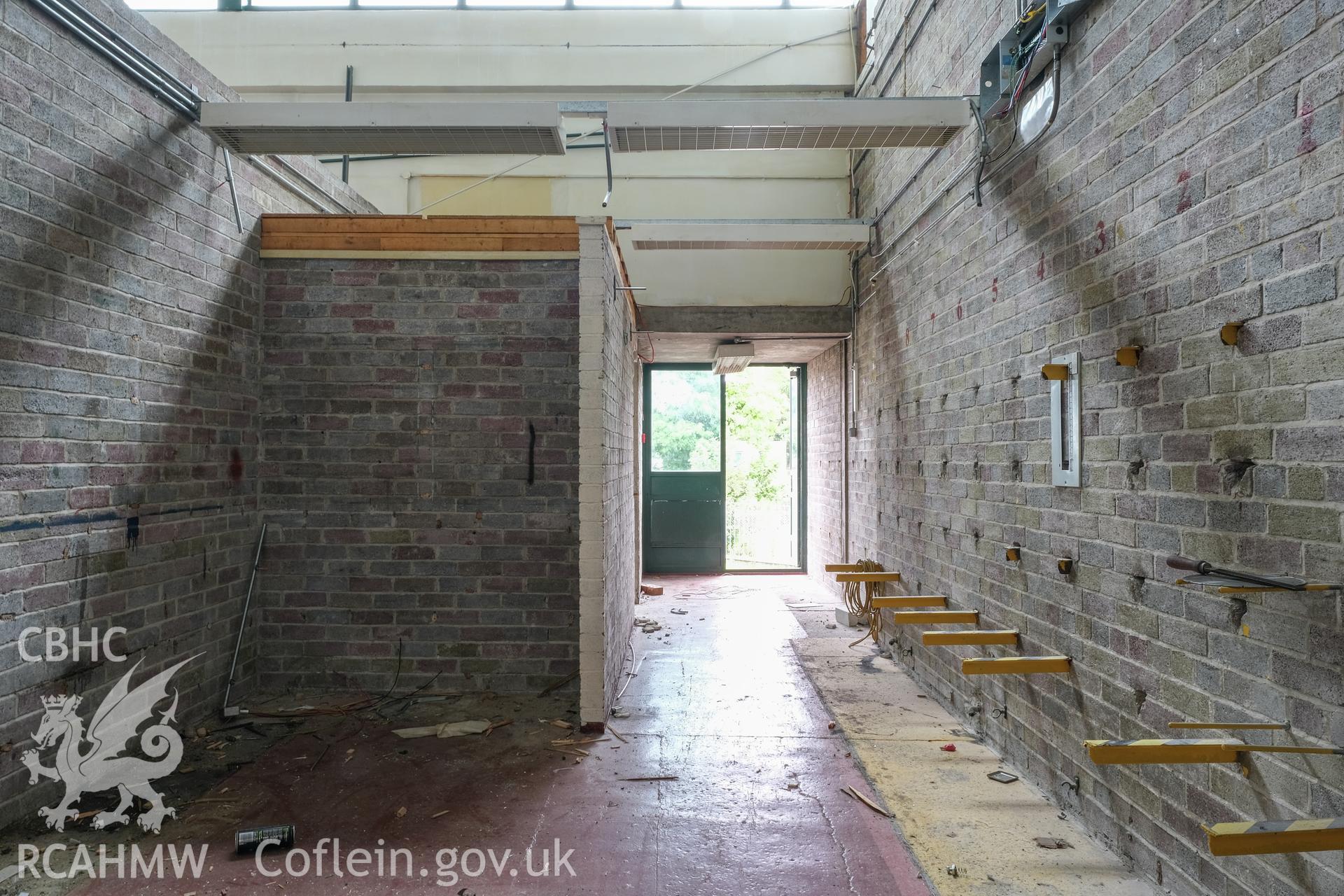 Digital colour photograph showing interior view of corridor and entrance at Caernarfonshire Technical College, Ffriddoedd Road, Bangor. Photographed by Dilys Morgan and donated by Wyn Thomas of Grwp Llandrillo-Menai Further Education College, 2019.