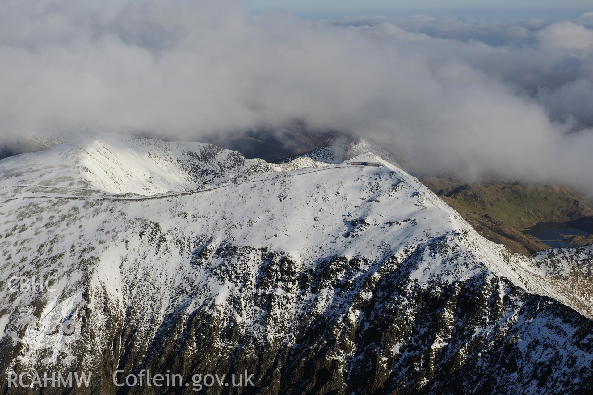 RCAHMW colour oblique photograph of Snowdon summit under snow, view from the west. Taken by Toby Driver on 10/12/2012.
