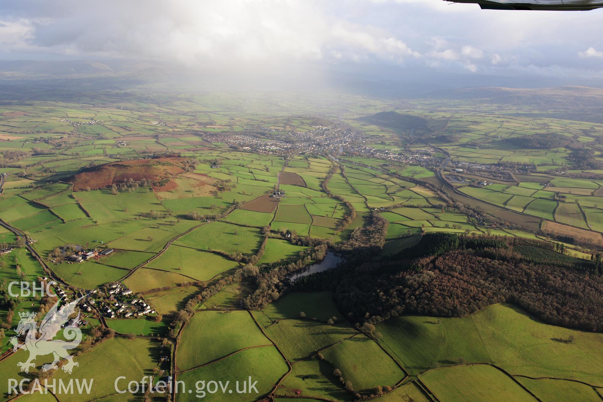 RCAHMW colour oblique photograph of Brecon, distant townscape from north-west, with rain show erupting. Taken by Toby Driver on 23/11/2012.