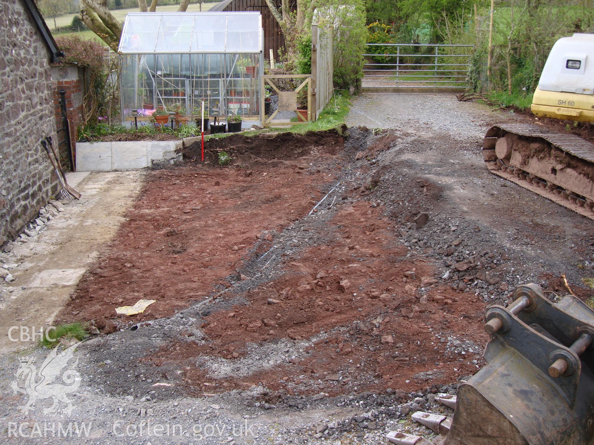 Digital colour photograph showing the final level of Area 1 showing service trench and driveway, looking North East. Taken from a watching brief of Vicarage Bungalow, Llanddeusant.