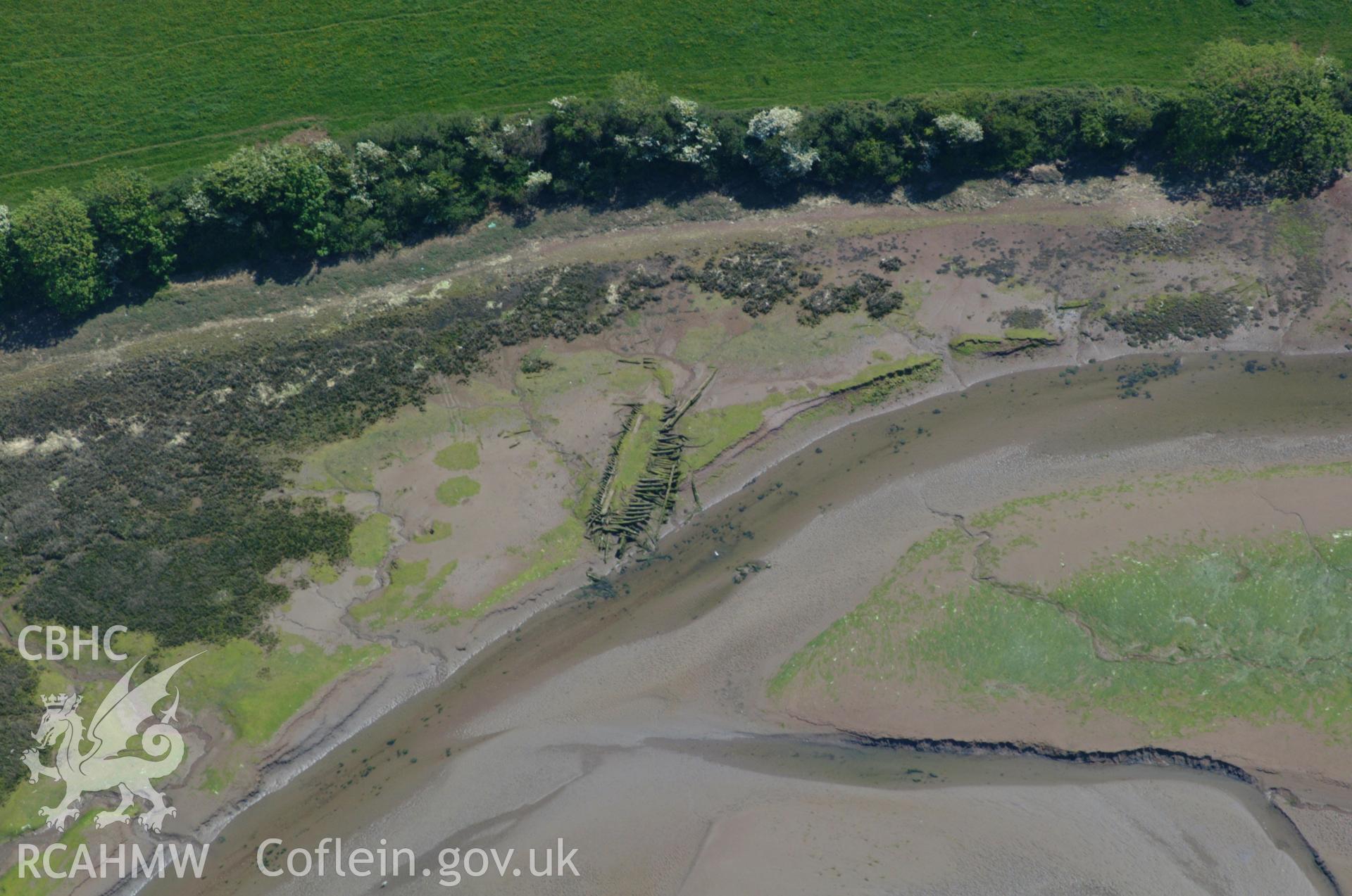 RCAHMW colour oblique aerial photograph of wreck, Sandy Haven Pill. Taken on 24 May 2004 by Toby Driver