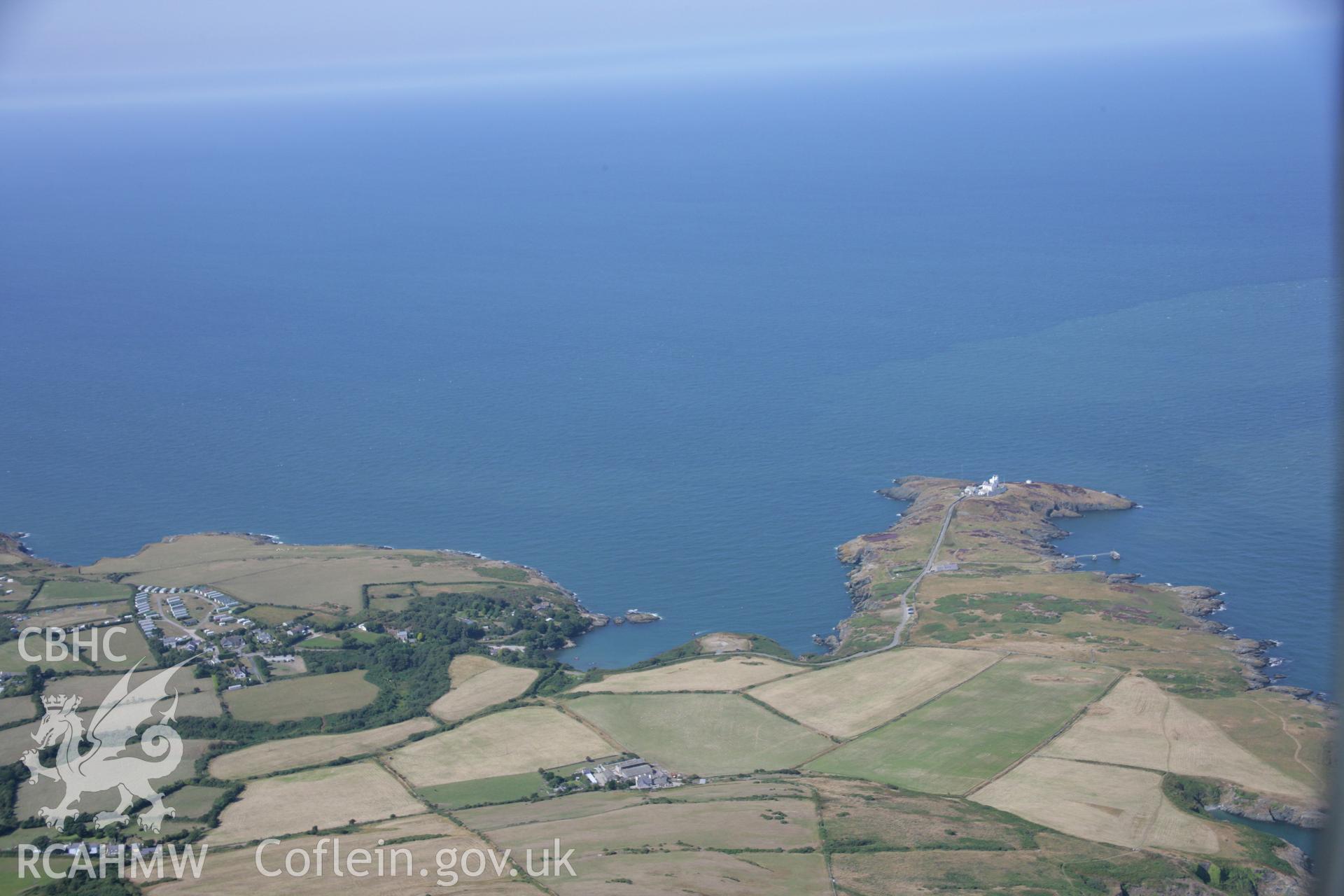 RCAHMW colour oblique aerial photograph of Elianus Point Lighthouse, Point Lynas in landscape view. Taken on 14 August 2006 by Toby Driver