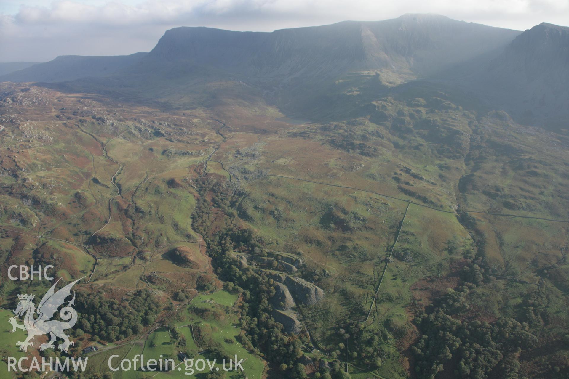 RCAHMW colour oblique aerial photograph of Chwarel Penryn Gwyn. A wide landscape view looking south-east towards Cadair Idris. Taken on 17 October 2005 by Toby Driver