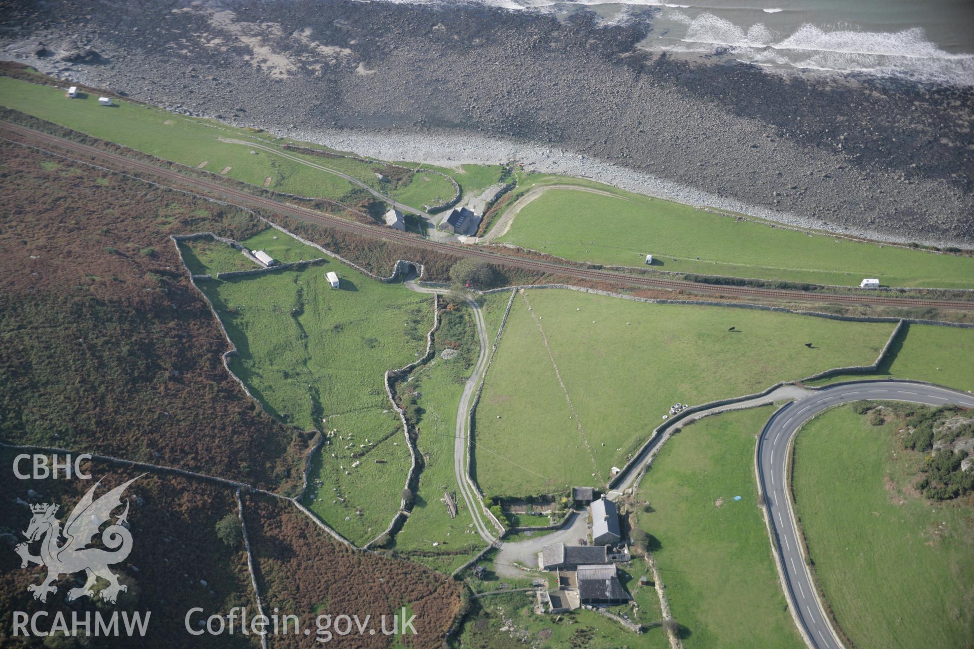 RCAHMW colour oblique aerial photograph of showing landscape view of cove and railway bridge, Felin Fraenan, viewed from the east. Taken on 17 October 2005 by Toby Driver