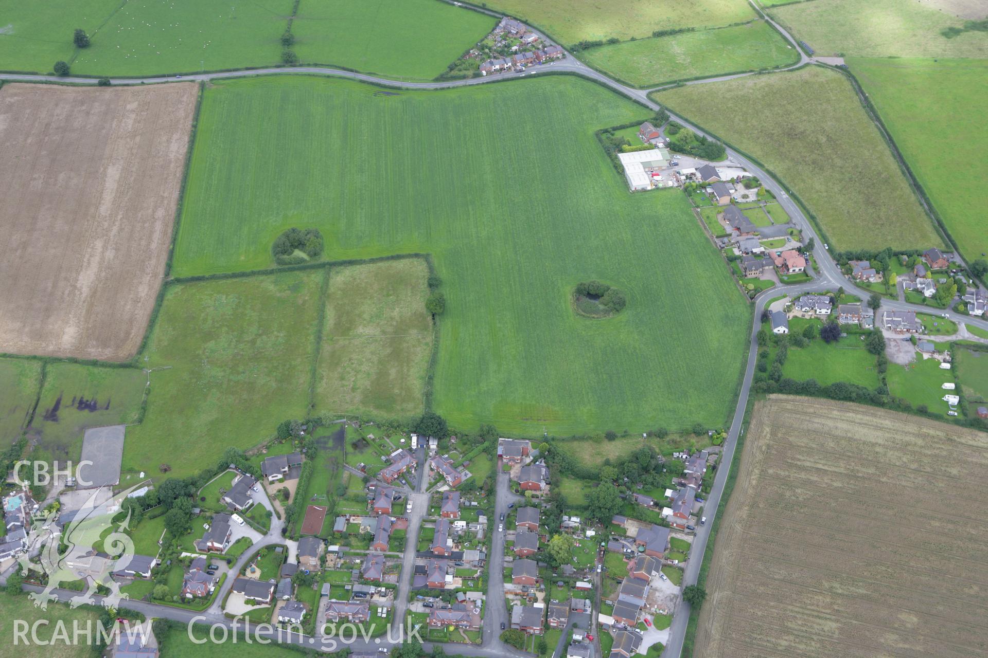 RCAHMW colour oblique aerial photograph of Trevalyn village, in general landscape view. Taken on 24 July 2007 by Toby Driver