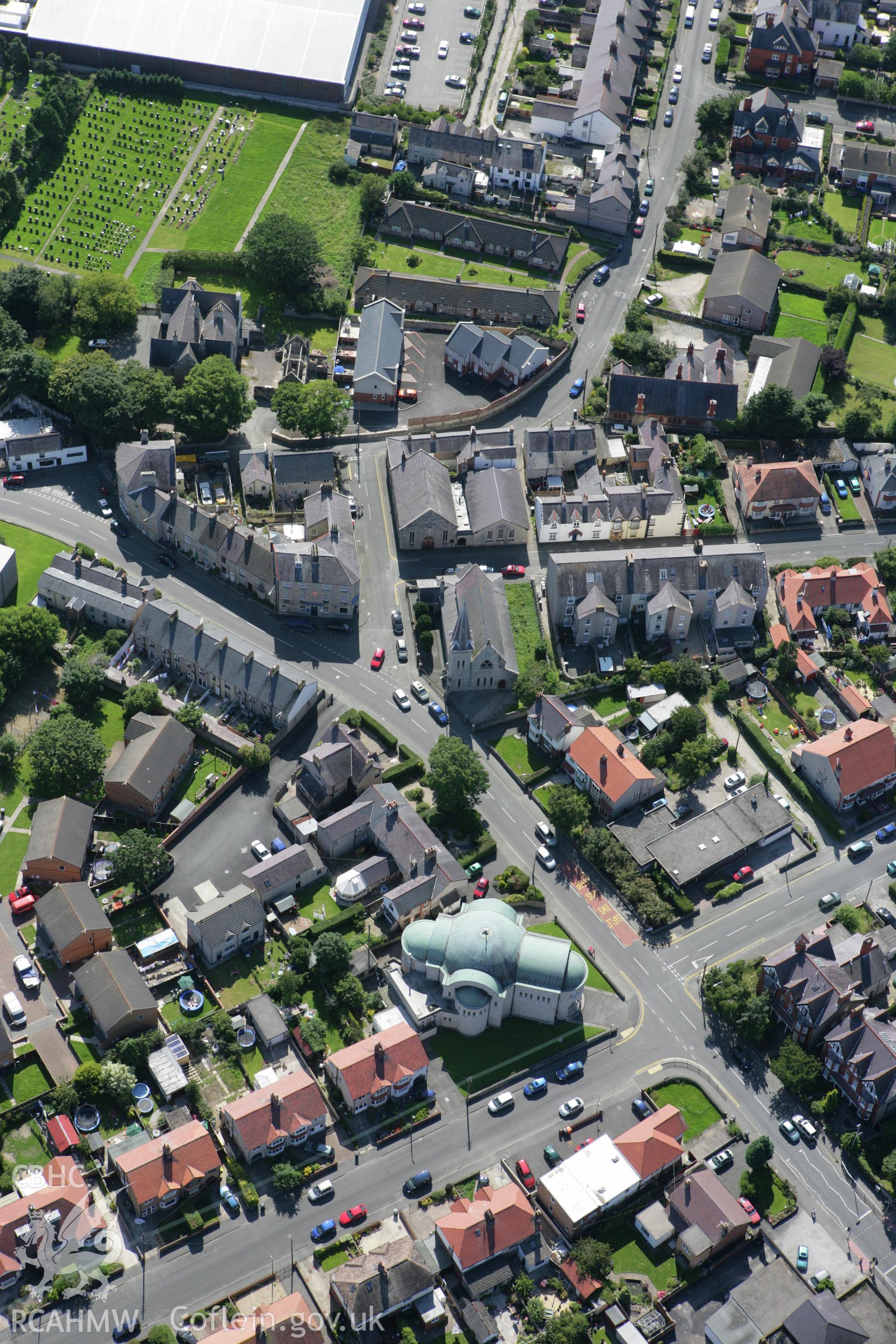 RCAHMW colour oblique aerial photograph of Abergele with the Catholic church visible. Taken on 31 July 2007 by Toby Driver