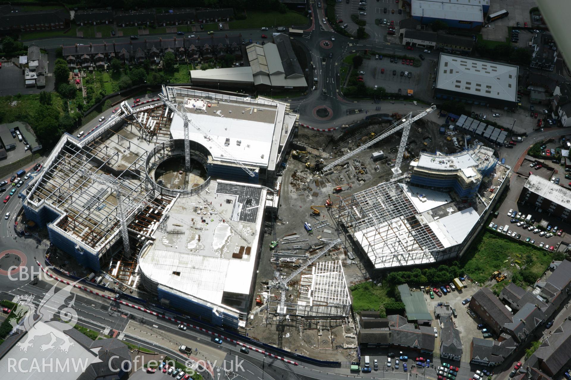 RCAHMW colour oblique aerial photograph of Wrexham, showing construction of a new shopping centre. Taken on 24 July 2007 by Toby Driver
